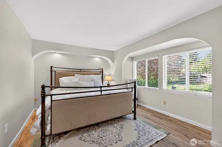 Look at the Architectural Detail within the Primary Suite! Easy Care Laminate Floors Extend Throughout the Home!