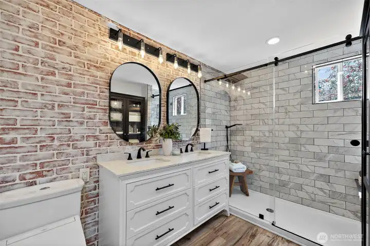 Spacious Primary Bathroom w/ New Slab Top Dual Sink Vanity, Updated Lights, Exhaust Fan, & Hardware & Oversize Shower w/ New Glass Door!