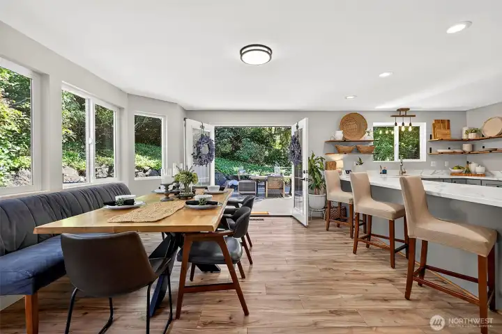 The Combined Kitchen & Gathering Room is an AMAZING Light Filled Space; the Heart of the Home!   French Doors Lead out onto the Trex-Style Entertainer's Deck!
