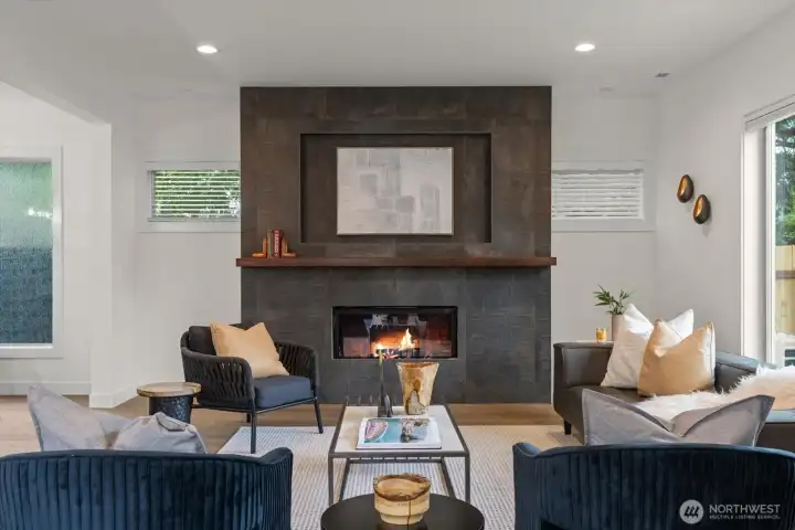 Dramatic floor-to-ceiling tiled fireplace feature wall.