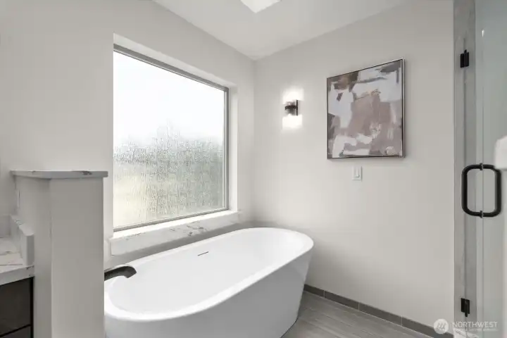 Spa-inspired primary en-suite bath soaking tub.