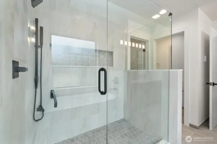 Beautiful child, primary shower built for two with an oversized nook for all your bathing needs