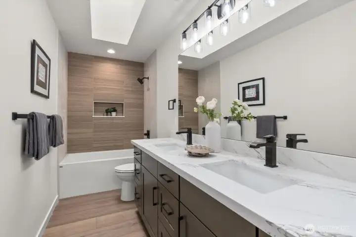 Beautiful second floor bathroom with double sinks.