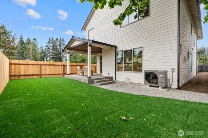 Landscaped and fenced back yard with covered patio area makes it perfect for entertaining.