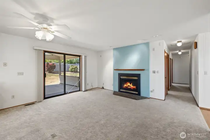 Rec room off kitchen with propane insert.