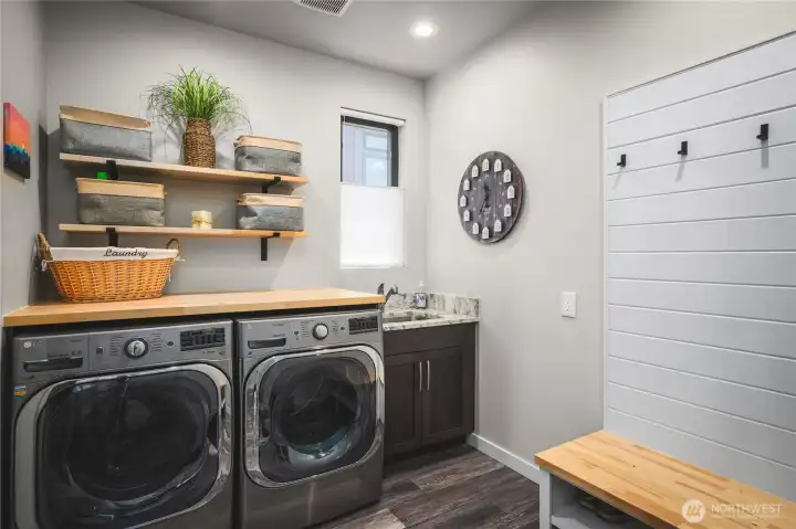 Laundry room adjoins Primary ensuite closet and entry from garage.