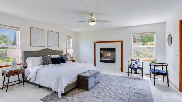 This primary suite upstairs is waiting for you to make this your own little retreat featuring double door entry, gas fireplace, tons of natural light, 5 piece en suite & a custom walk-in closet!