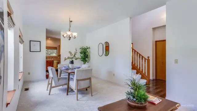 Formal living & formal dining space are open to each other and just steps from the entryway and kitchen, making this an ideal layout for hosting.