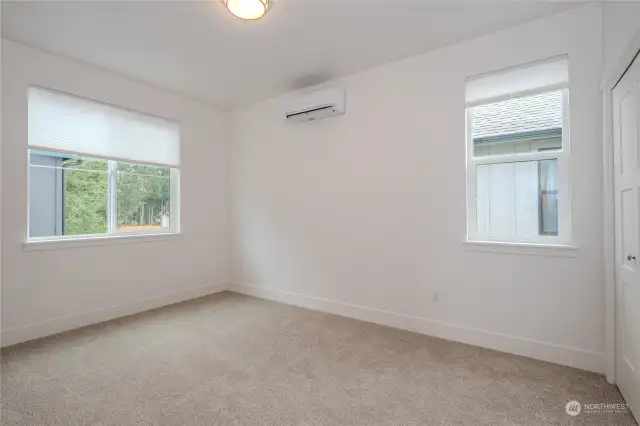 The second upstairs Bedroom is generously sized and carpeted for comfort. It boasts a dedicated ductless mini-split heating & cooling and a sizable closet.