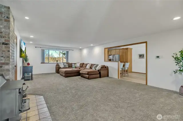 Large family room with wood burning stove.