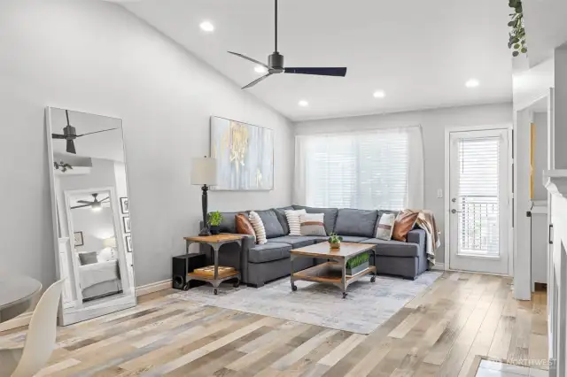 Light filled open floor plan with vaulted ceilings.