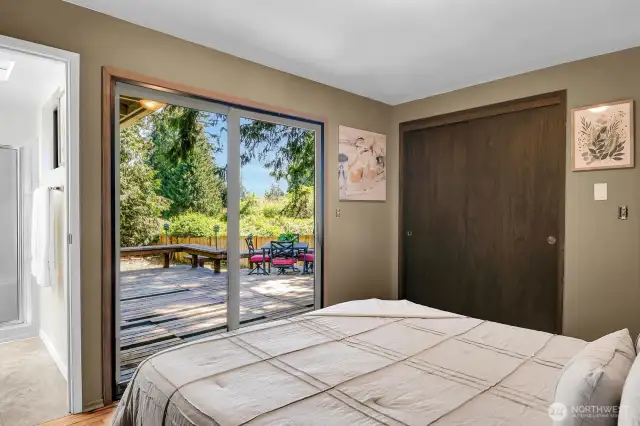 Primary bedroom features a slider to the back deck—perfect for morning coffee or evening unwinding.