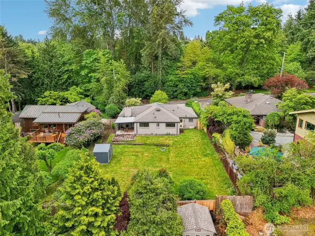 South aerial view of the backyard and exterior.