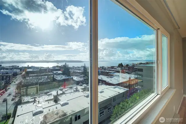 Expansive southwest view to Alki and all the way to the Kitsap Peninsula.
