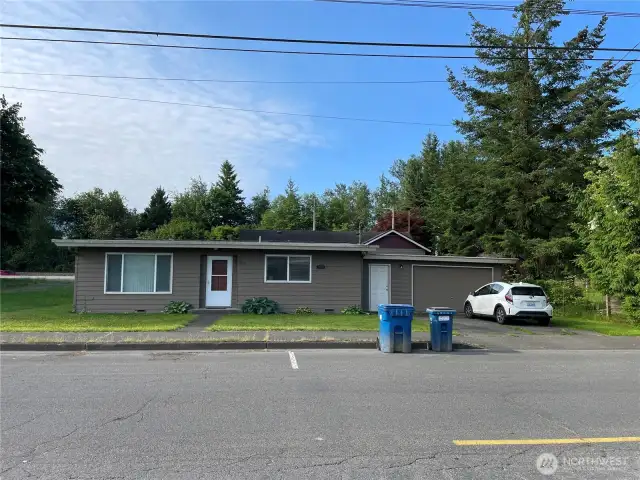 The rental property that fronts on Main St offers 864 sq. ft., 2 bedrooms, 1 bath, and a single car attached garage.