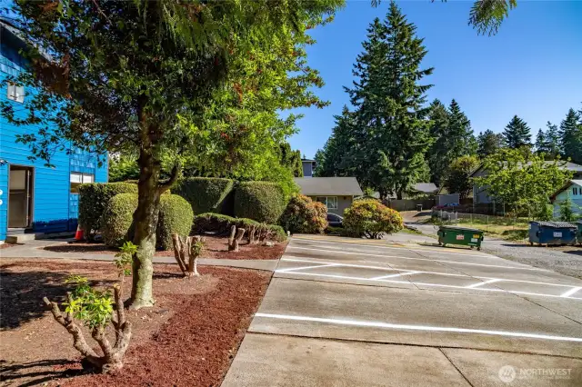 Parking spaces are extra long, each with an accessible walkway along their side.