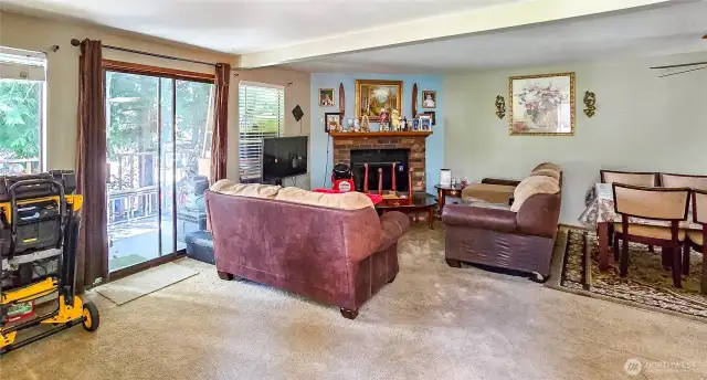 Unit 4 - Interior living room area w/ wood-burning fireplace