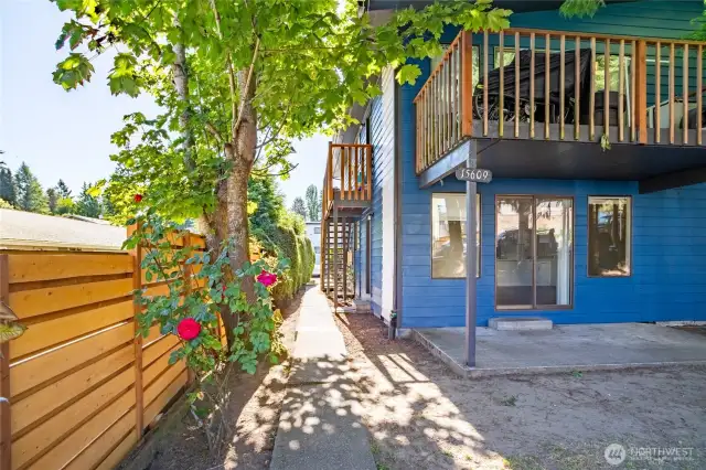 Partially fenced for more privacy. Lower units feature concrete patios while units on second floor have a large private decks.
