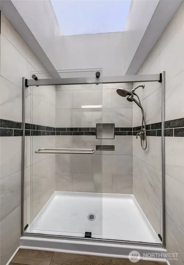 Master bath with glass shower enclosure