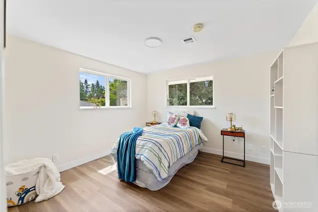Large sunny corner bedroom