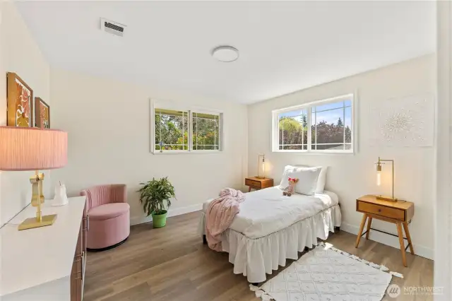 Spacious bedroom with closet just out of view