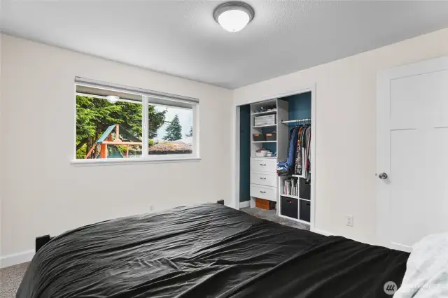 Bedroom 2 with closet built-ins and fresh paint