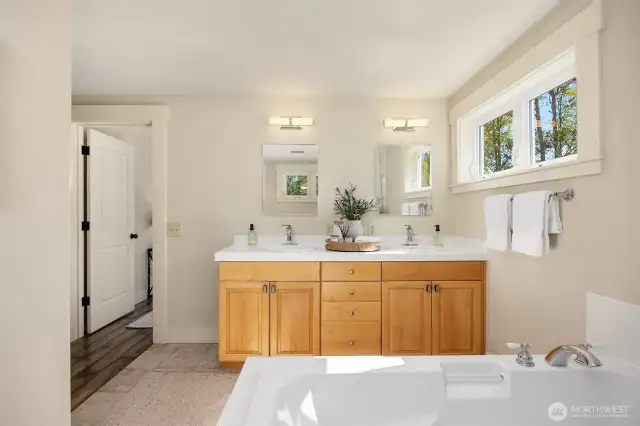 Primary bathroom with double vanity, huge soaking tub, and walk-in-shower.