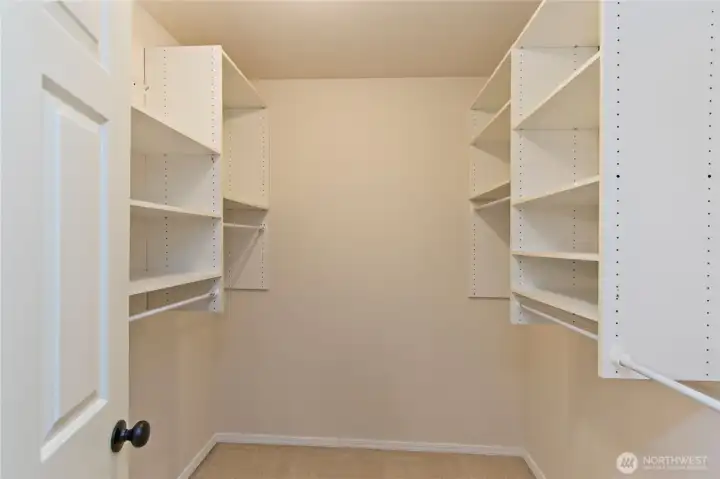 Primary bedroom walk in closet