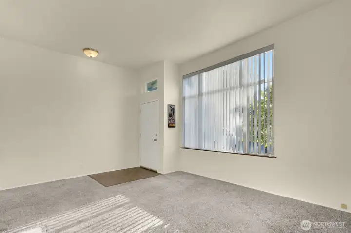 Vaulted ceilings & newer windows throughout.