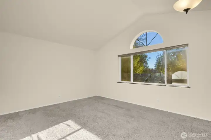This primary suite gets plenty of natural light.