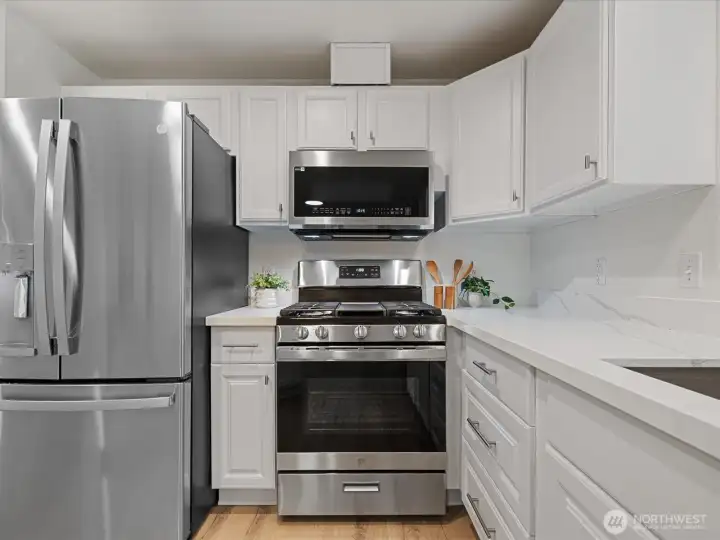 New appliance package with gas stove, steam microwave and large refrigerator