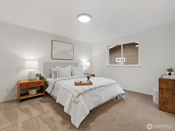 Cozy primary bedroom with new lighting