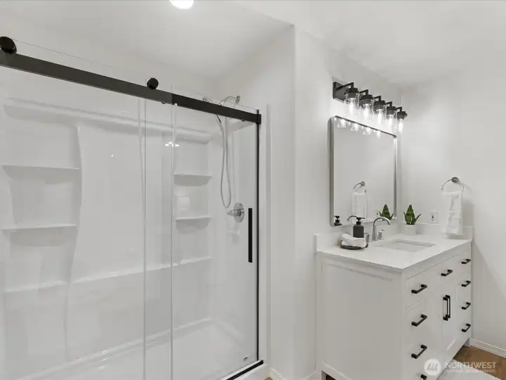 Styling lighting with lots of room to move around, and walk-in shower with glass doors