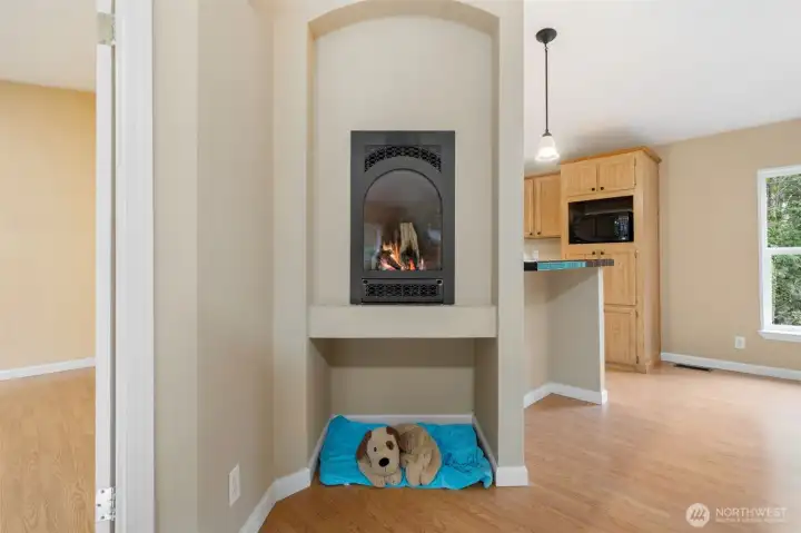 This little gas fireplace will heat the whole house. There's also gas forced air furnace.