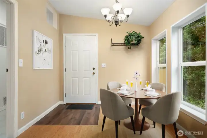 Photo contains virtual staging. Walk-in pantry and laundry are to left in this photo. Entry is updated to high durability flooring. Door is new.