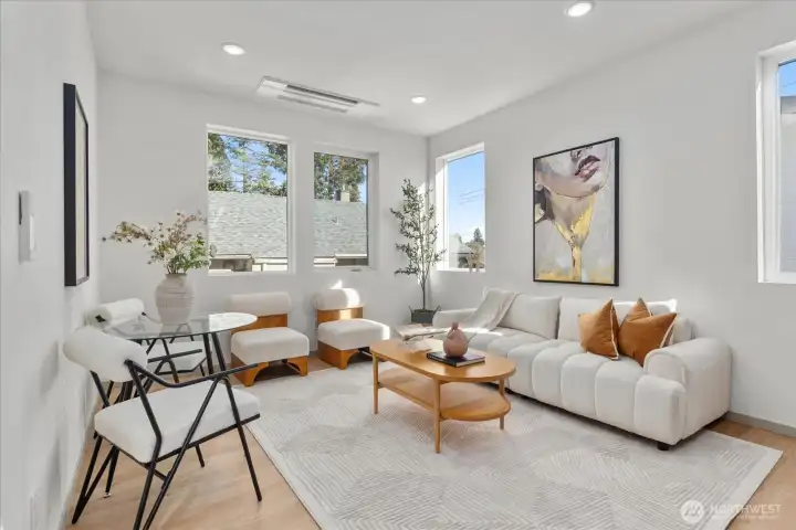 Open concept living area bathed in natural light.