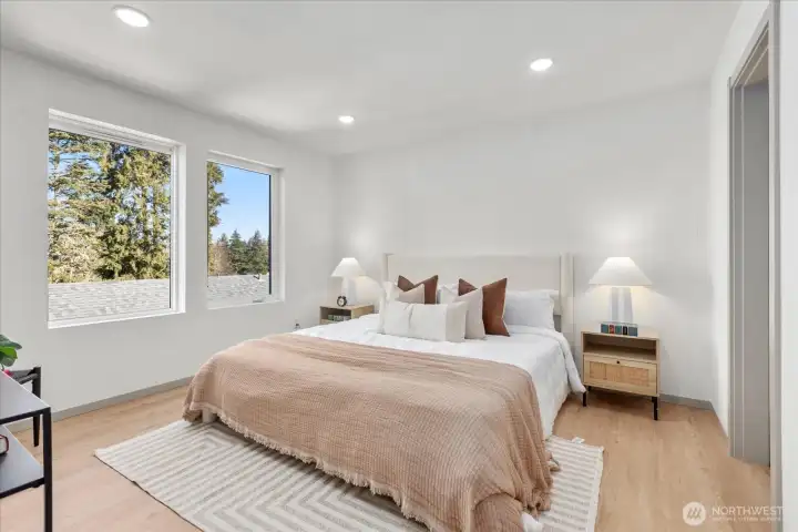 Luxurious owner’s suite with abundant natural light.