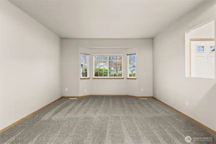 Spacious living room with a lovely bay window.