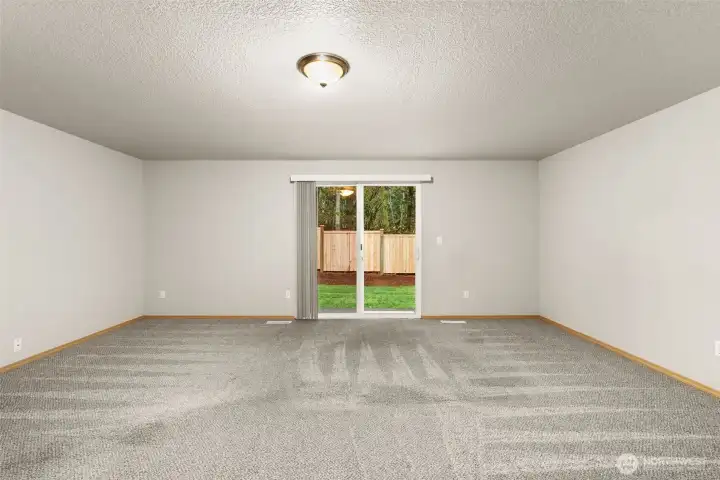 Lower-level features an oversized bonus room with access to the the back yard.