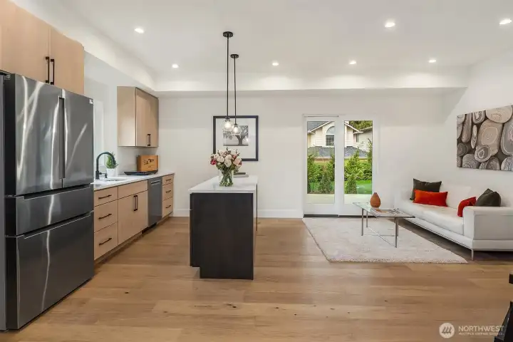 Lower-level Mother-in-law unit offers a completely separate living space with private entry and patio access