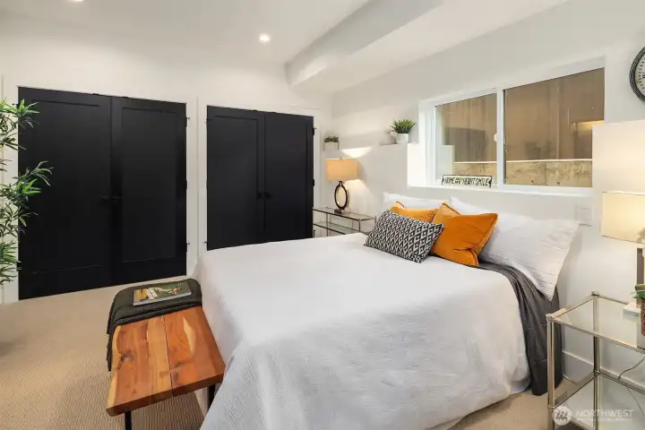 One of two generous bedrooms, note all the closet storage!