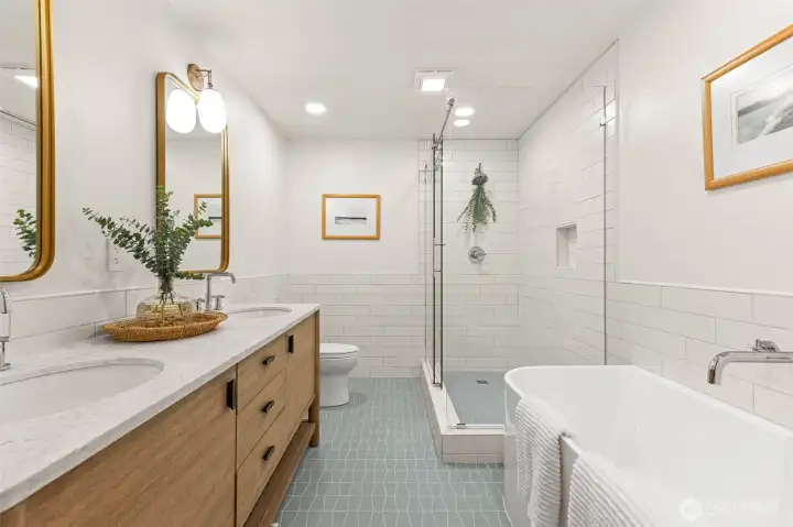 Fully updated primary ensuite with double vanity and soaker tub.