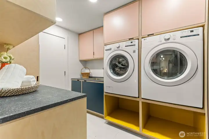 Main floor laundry room with wash basin