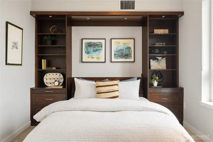 This Murphy bed, when up, has a drop-down desk, converting this west-facing view bedroom into an office