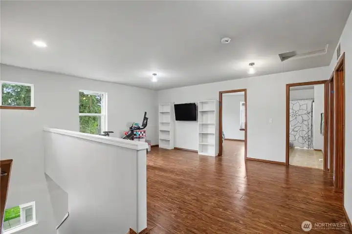 Upstairs is a loft area with plenty of room for the family