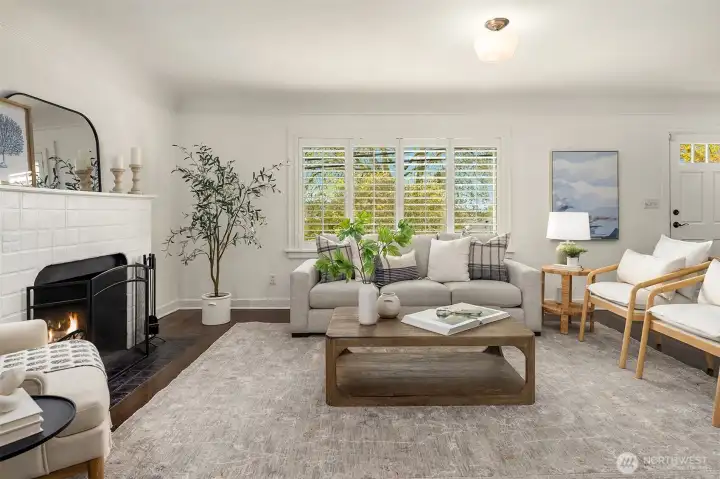 Generous living room with wood fireplace
