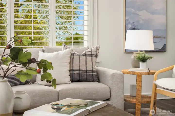 Generous living room with wood fireplace