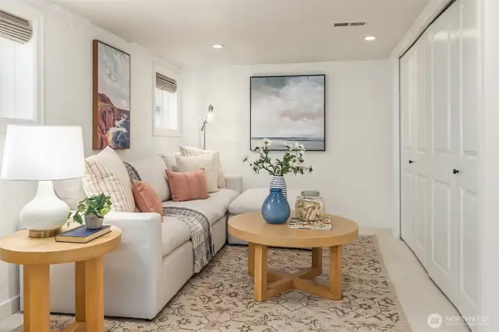 Lower level with bonus room, built in wall bed, sauna, and laundry room