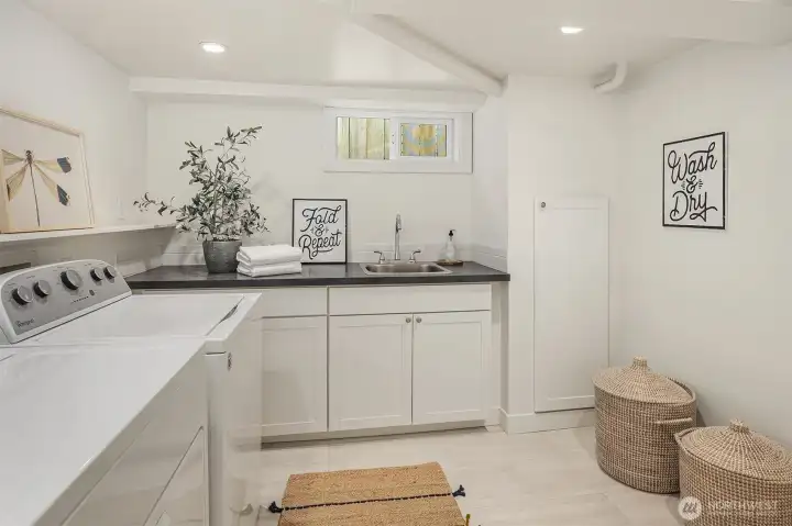 Lower level with bonus room, built in wall bed, sauna, and laundry room