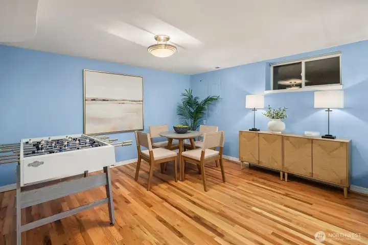 A versatile lower level space with warm hardwood floors and abundant natural light serves equally well as a guest bedroom, home office, or hobby room, offering the flexibility modern living demands.